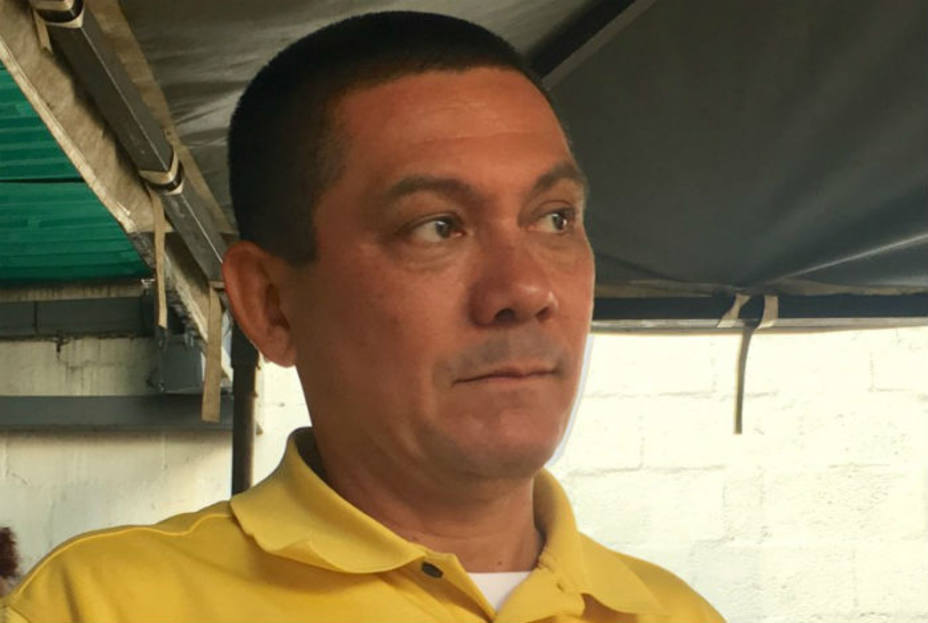 Fernando Albán wearing a yellow shirt